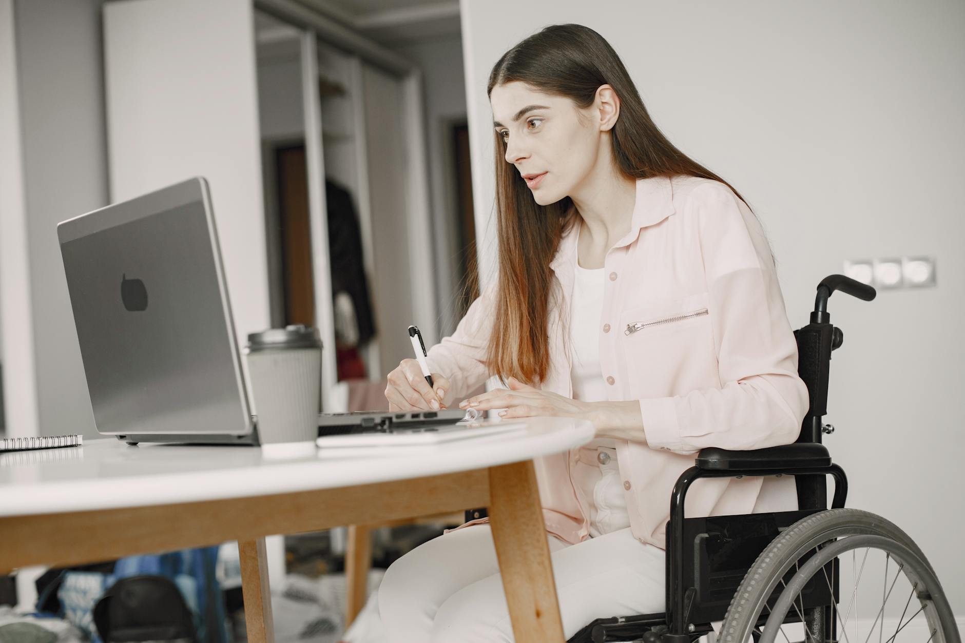 a woman on a wheelchair working